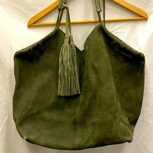 Olive green suede hobo bag with tassels handmade in Kenya.